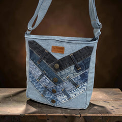 Bidora patchwork denim crossbody bag with light and dark wash fabric, button accents, and a branded leather patch.