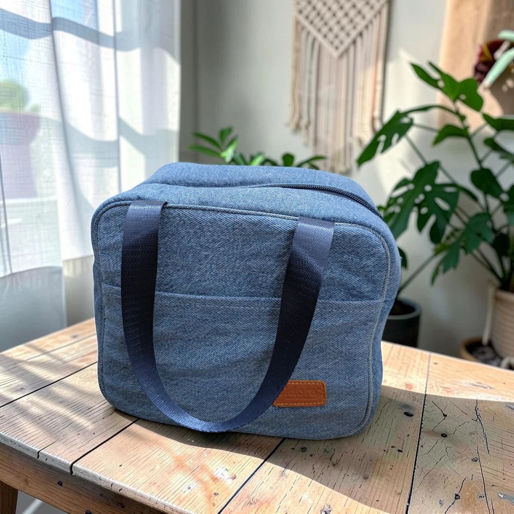 Bidora insulated lunch tote bag in blue denim-look fabric with sturdy nylon handles and a leather-style logo patch.