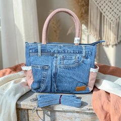 Bidora denim handbag with patchwork blue fabric, dusty-pink side panels, lace trim, and detachable shoulder strap.