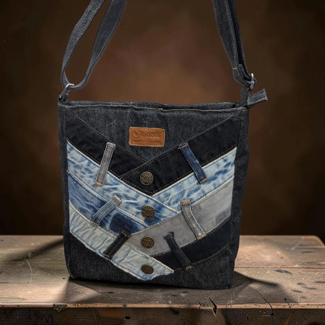 Bidora upcycled denim patchwork crossbody bag with metallic button accents and adjustable shoulder strap