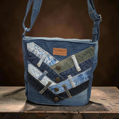Bidora upcycled denim crossbody bag with chevron patchwork, metal buttons, and adjustable shoulder strap.